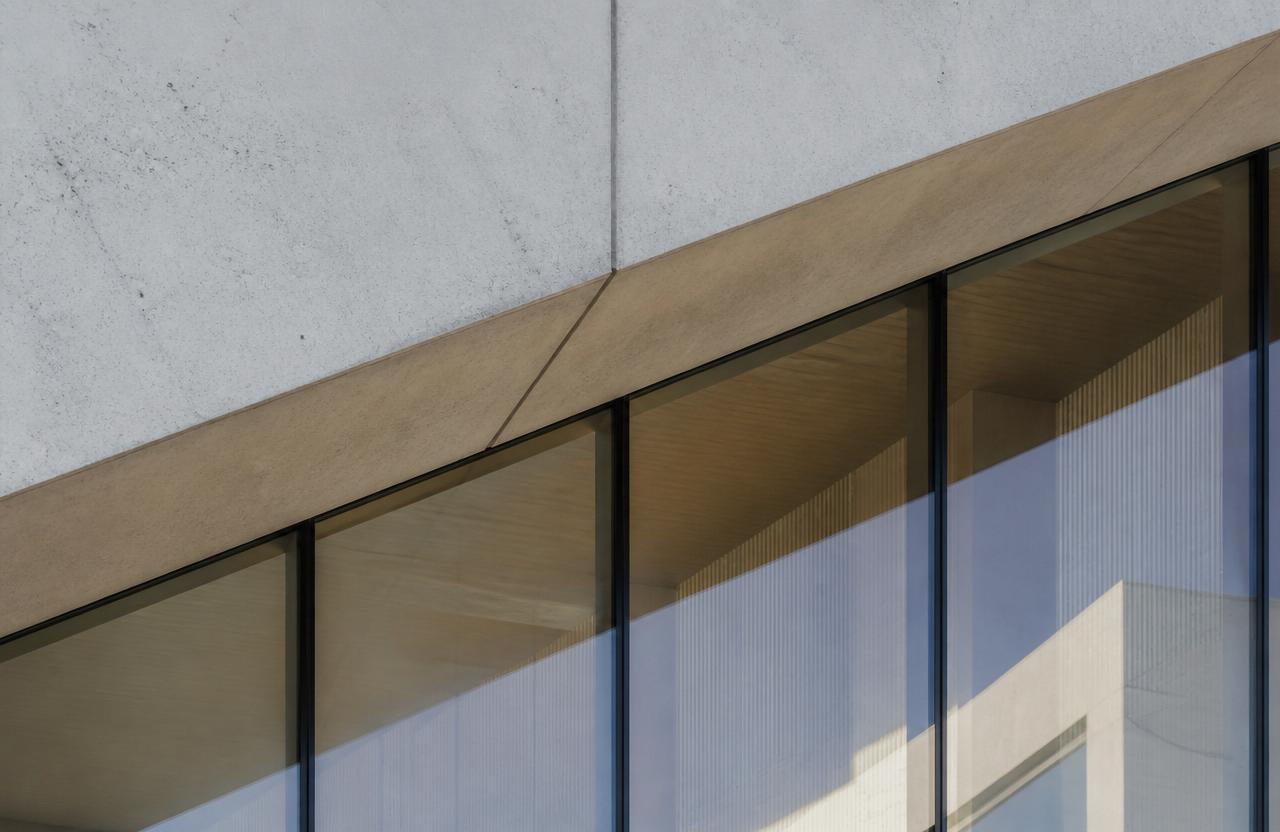 Clean architectural detail of concrete and glass in soft daylight
